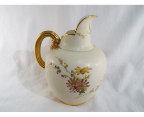 Royal Worcester - a flatback jug decorated with floral sprays on a blush ivory ground with gilded handle and borders, shape n