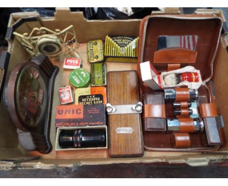 A good mixed lot to include a quantity of vintage tins, an Metamec Dereham wind up mantle clock, tie press, grooming travel k