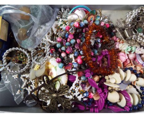 A good mixed lot of unsorted costume jewellery to include a Baltic amber bracelet, natural jade stone and a white metal neckl