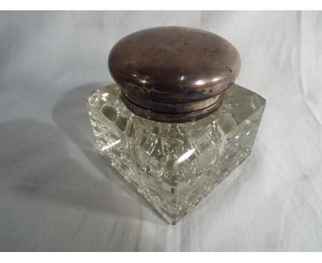 A hallmarked silver and glass topped inkwell, Birmingham assay by Walker and Hall