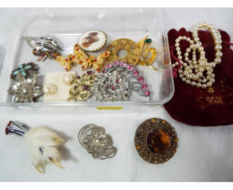 A small collection of vintage costume jewellery to include silver earrings, Indian silver brooch, Jersey pearl necklace and s