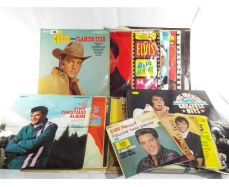 A collection of fourteen Elvis 33.3 rpm vinyl to include Greatest Hits, GI Blues and other and a collection of ten 45 rpm vin