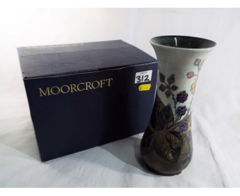 Moorcroft - a Moorcroft vase marked to the base Moorcroft on a light blue ground decorated with raspberries, approximate heig