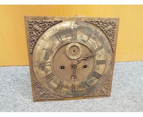 An 18th century 8-day longcase clock movement and brass dial, applied silvered chapter ring, seconds ring and cast cherubs he