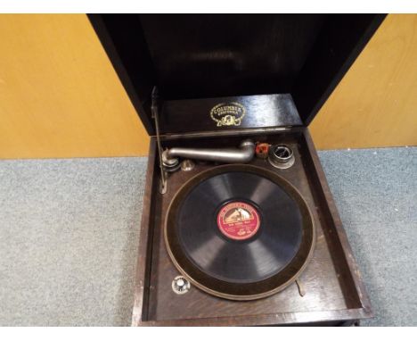 A oak cased table top Columbia Grafonola by Magic Notes with wind handle, two tins of spare needles and His Master's Voice Bl