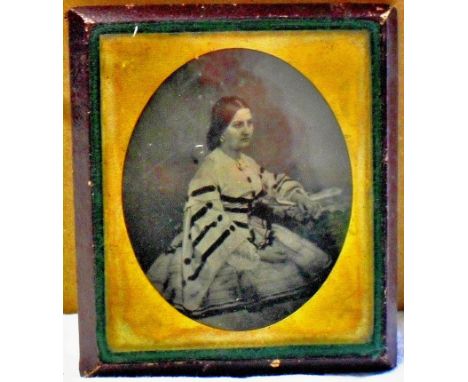 Ambrotype - A leather cased miniature frame. Black and white portrait of a seated lady. Excellent quality.