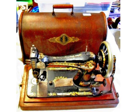 Vintage original or earlier Singer Sewing Machine, with original cover and accessories