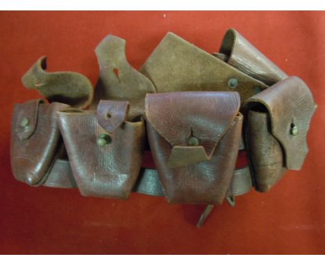 WWI Period Brodie Pattern Helmet shell with a leather five pouch bandolier.
