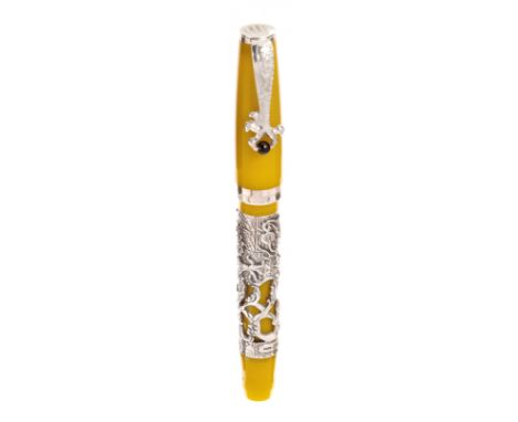 MONTEGRAPPA FOUNTAIN PEN "ZODIAC".Yellow resin barrel with silver case with dragon.Limited edition.Two-tone 18 Kts gold nib. 