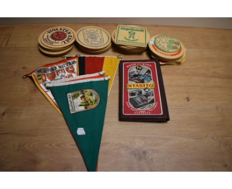 A small selection of vintage beer mats, banners and a vintage Stabilo pencil set.