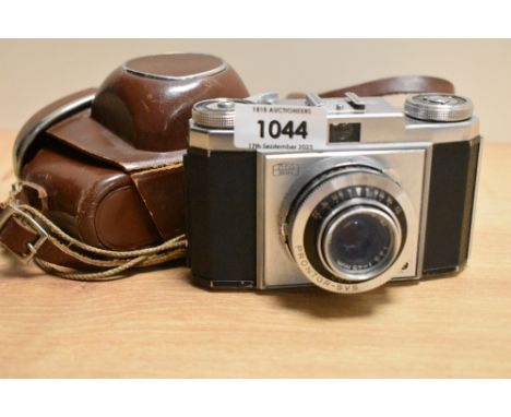 A Zeiss Ikon camera with 1:3,5 f45mm lens in leather cover and Yashica light meter