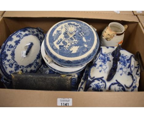 A carton of mainly blue and white ware including chargers and tureens, a blue and white cheese dish, a set of cased cake knif