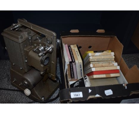 A vintage Specto (Type PC) 500W variable speed 8mm film projector (Circa 1950) and a selection of film reels