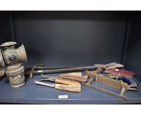 A collection of assorted tools including farier's equipment and a woden side plaine etc