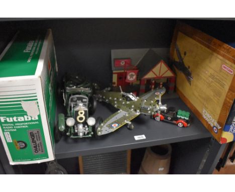 A modern Meccano Supermarine Spitfire, made up with original box along with a Golden Wheel Texaco plastic Garage with diecast