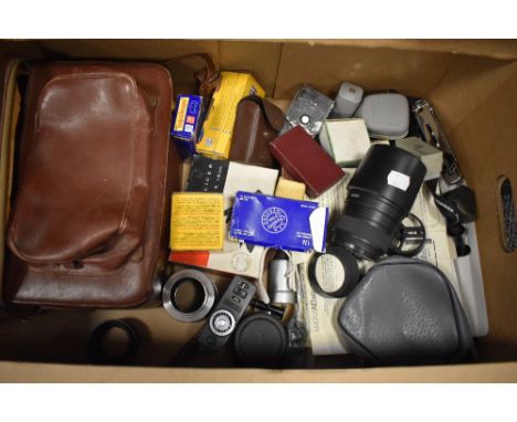 A box of various camera and photographic items including Sigma zoom 55-200mm 1:4-5,6 DC lens, Hanimex film splicer, various r