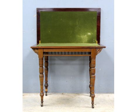 Early 20th century mahogany fold over card table on turned supports,