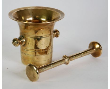 AN EARLY TWENTIETH CENTURY CONTINENTAL BRASS COFFEE GRINDER,  together with an ANTIQUE BRASS PESTLE AND MORTAR 