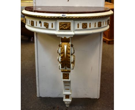 A painted and parcel gilt empire style console table with a marble top.