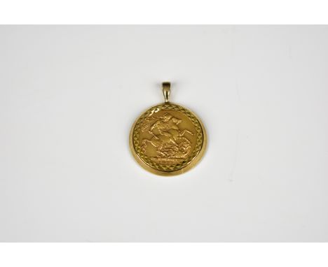 A 1911 George V full gold Sovereign in 9ct gold mount. 