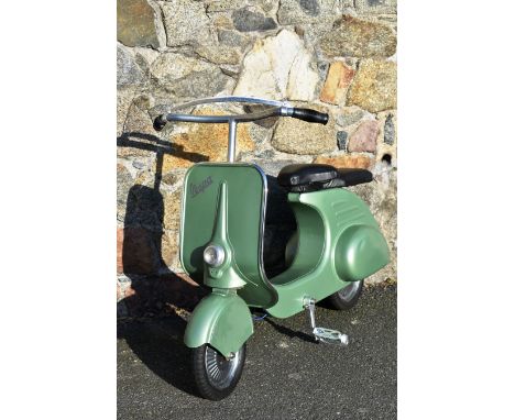 A vintage restored Vespa Pedal Scooter 1953, by Pierre Guy, the re-sprayed metallic green scooter with new modern parts, to i