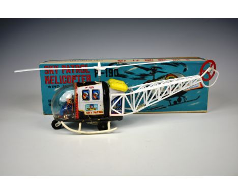A vintage c1960's Tinplate Wind-up Sky Patrol Helicopter P-190 made in Japan, boxed, toy very good, working, light wear to ti
