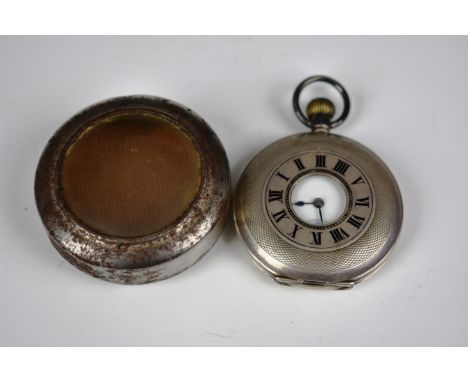 A silver cased half hunter pocket watch, c.1913 import hallmarks for London 1913, the engine turned 48mm. case with black ena