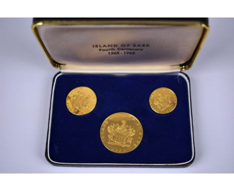 A cased set of special "Sark" 22carat gold medals/coins the set of three coins recording the 400th anniversary, the case lid 