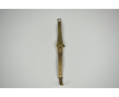 A ladies 9ct gold Rotary manual wristwatch hallmarked London 1972, the rounded rectangular champagne dial with black baton ma