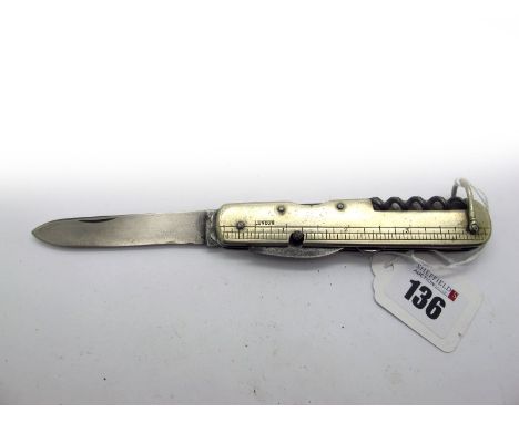 Clements of Sheffield; A Single Blade Knife, with tin opener, corkscrew, button hook, nickel silver scales with rule measurem