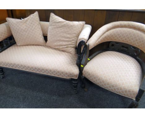 LATE VICTORIAN EBONISED CANAPE SOFA, 118cms wide and a tub chair similar (2)