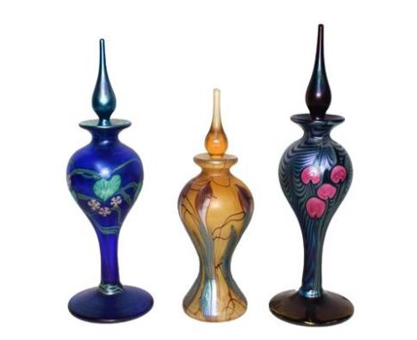Okra glass, comprising: three iridescent scent bottles, one titled Viola 30/500, 24cm, one title Syclamen 8/500, 24cm, and a 