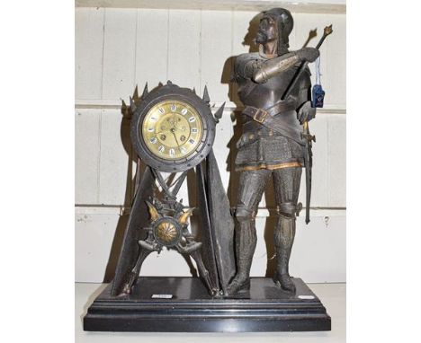 An early 20th century spelter figural mantle clock surmounted by a knight, housing a French movement with visible anchor esca