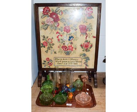 A 19th century needlwork panel worked in coloured wools in cross stitch with flowers and foliage by Mary Ann Moore, Work done