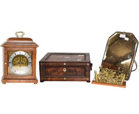 A 20th century oak cased table clock signed Comitti, housing a three train German movement, together with a 19th century rose