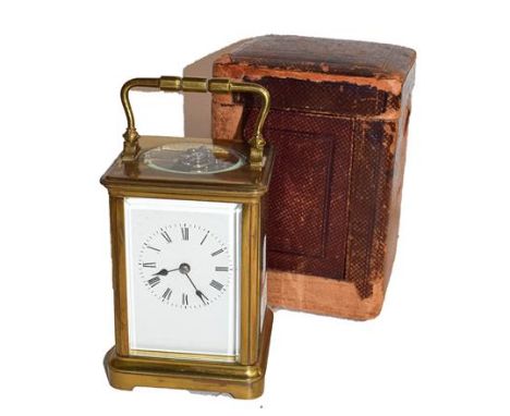 A brass striking carriage clock, circa 1900, with twin barrelled movement and later platform escapement, striking on a gong, 