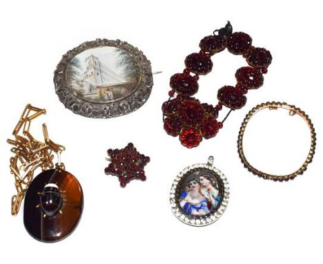 An agate pendant on chain, a garnet bangle, a garnet bracelet, a garnet brooch, a miniature locket/pendant and a miniature br
