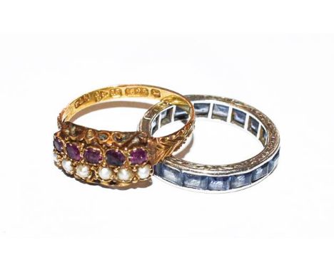 A 15 carat gold garnet and split pearl ring, finger size M; and a sapphire eternity ring, finger size J.  Garnet ring - 1.8 g