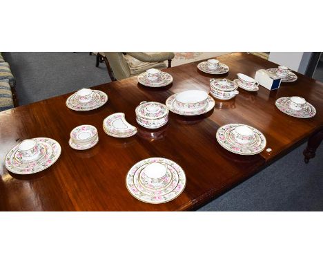 A Royal Worcester part dinner service in Royal Garden pattern, including a pair of tureens and ten dinner plates (one shelf) 