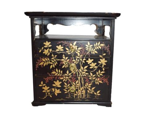 An early 20th century Japanese lacquered table cabinet, decorated in gilt and red enamel with fruiting branches, 35cm by 26cm