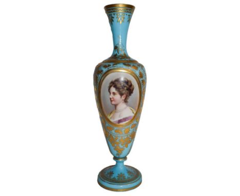 A Victorian painted and gilt blue glass vase decorated with a portrait, 42cm high