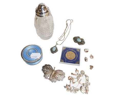 A silver topped glass sugar caster, silver charm bracelet, guilloche enamel silver box, costume jewellery, and pre-decimal co