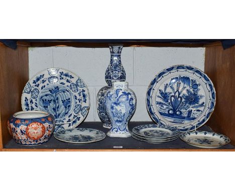 A quantity of 18th century and later Continental Delft, including chargers, vases, pancake plate, together with three 18th ce