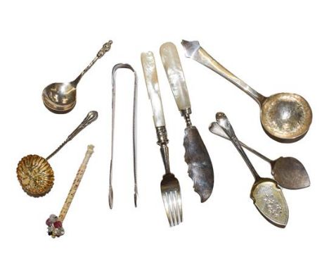 A quantity of silver spoons and sugar tongs, including an Arts and Crafts caddy spoon with planished bowl by Sandheim Brother