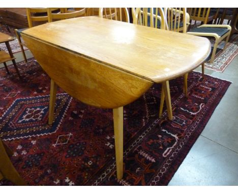 An Ercol elm and beech Windsor drop leaf table 