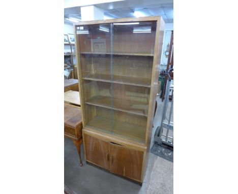A vintage light oak bookcase 