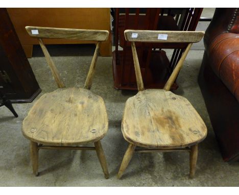 A pair of Ercol elm and beech child's chairs 