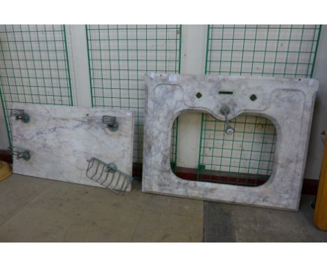 A marble splashback and basin 