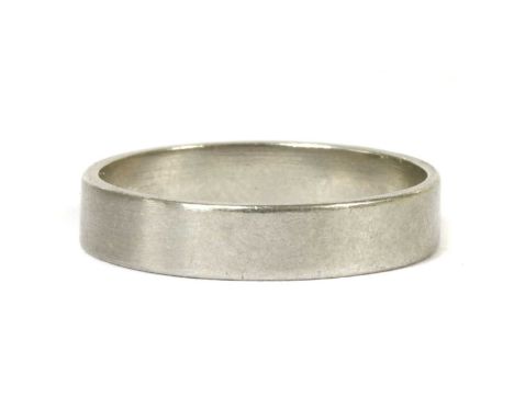 A platinum flat section wedding ring, marked PLAT, 4.08g.Finger size M½ (approximately)Condition report: Ring very slightly o