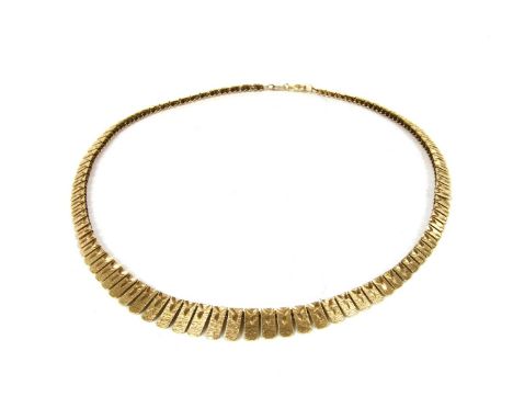 A 9ct gold graduated fringe necklace, with textured finish and bright cut engraving, with bolt ring clasp, import hallmark Bi